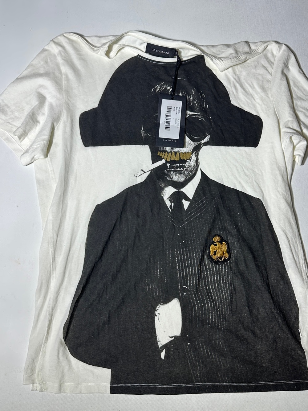 Les Hommes White Tee with Black Skull Graphic and Gold Crest
